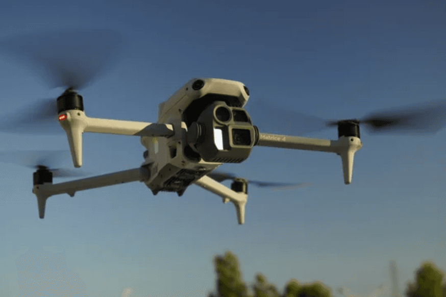 Drone flying over a bulk material site for aerial inventory capture