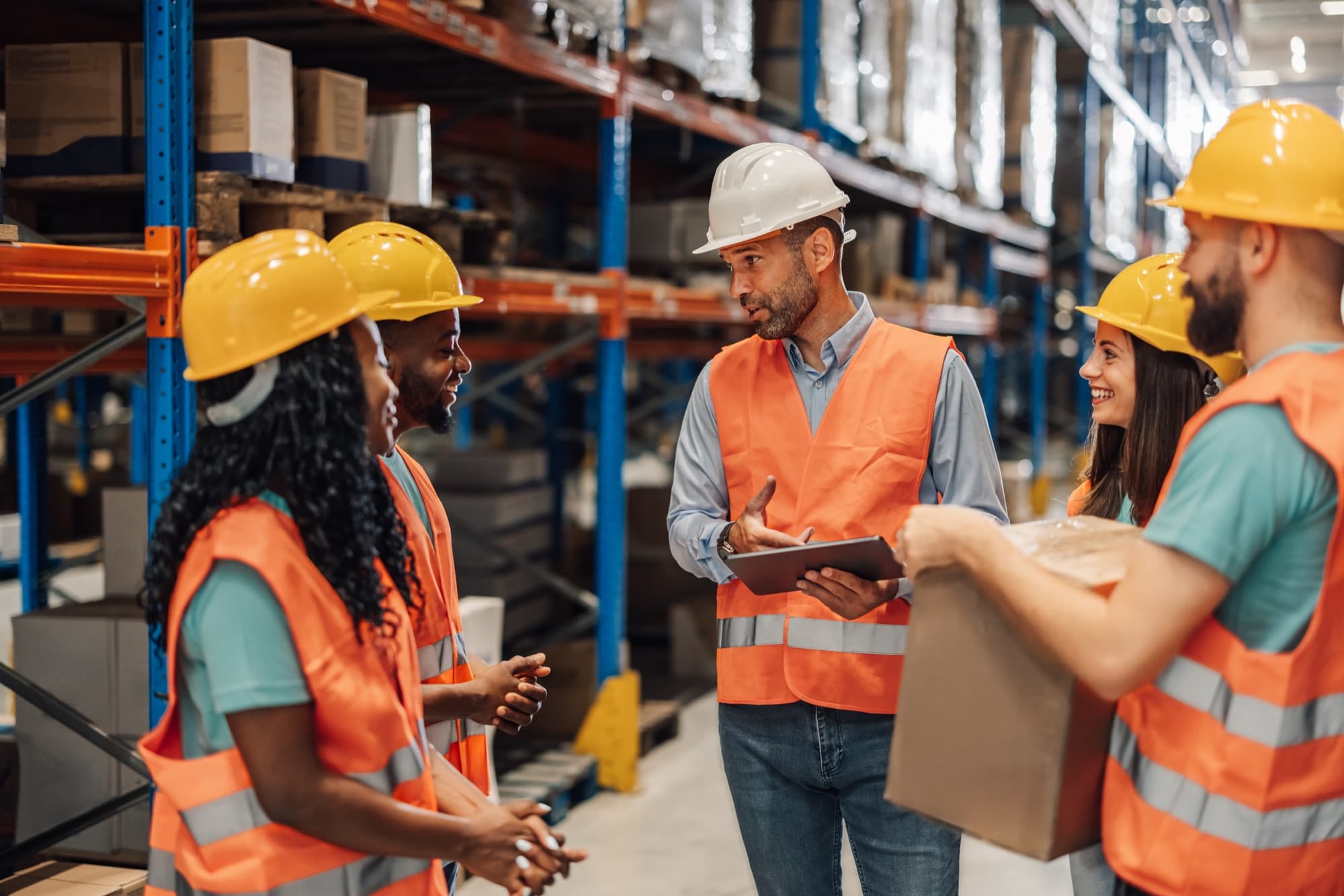 Warehouse team discussing operations on the floor