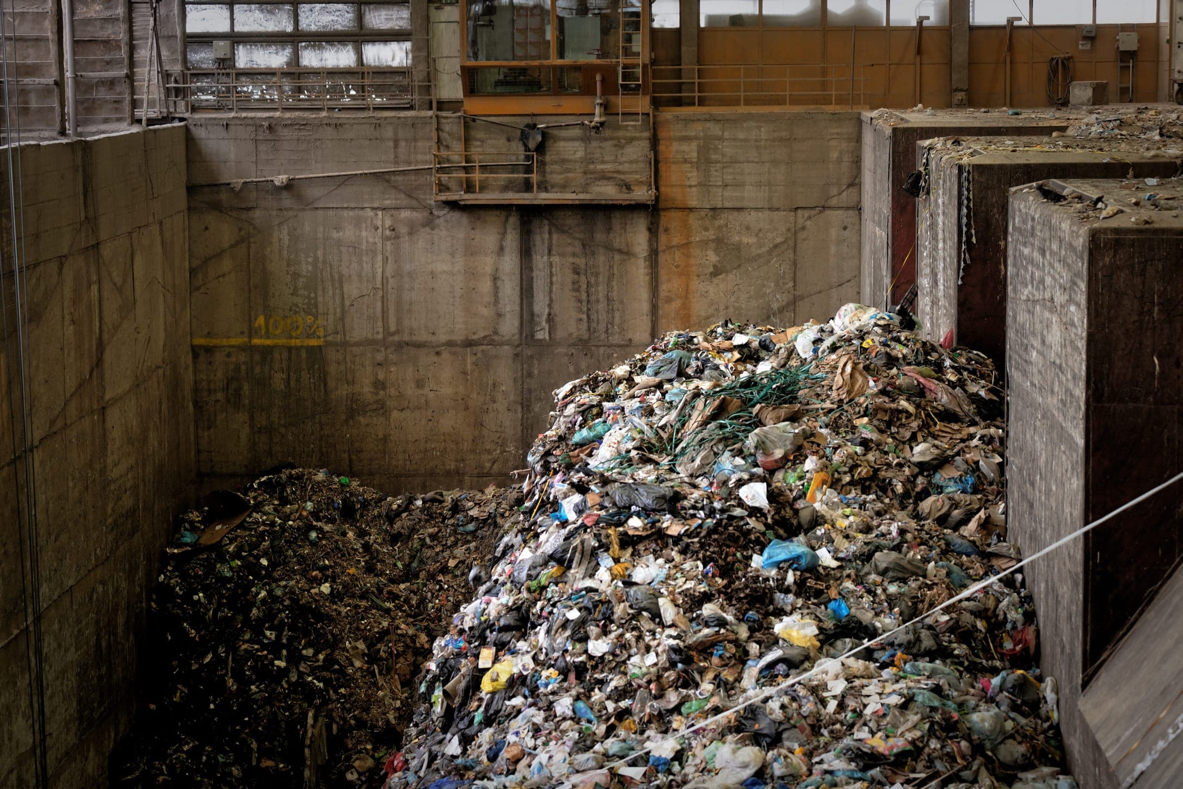 Large heap of garbage inside a processing plant