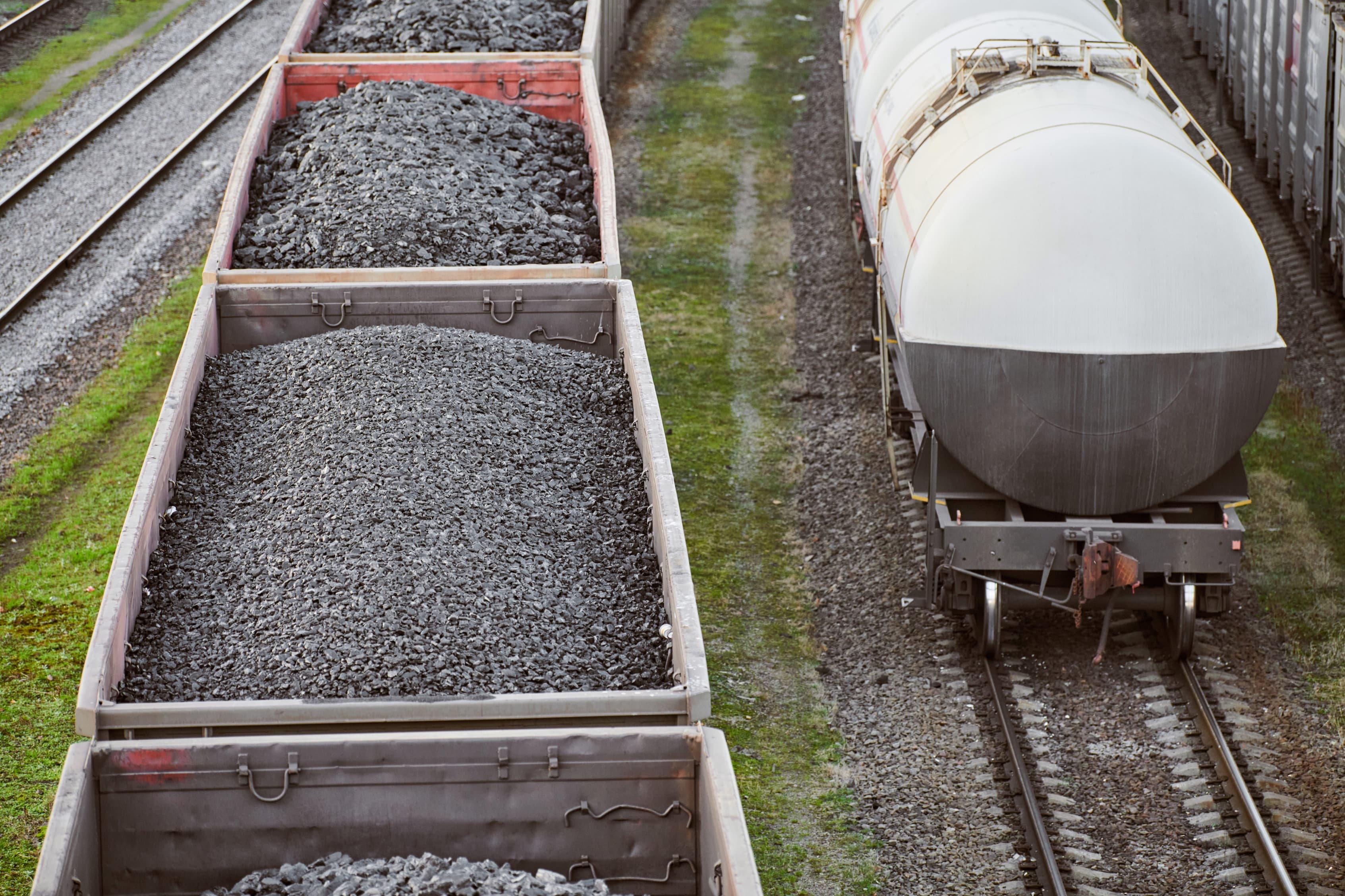 Freight train with cargo cars transporting coal